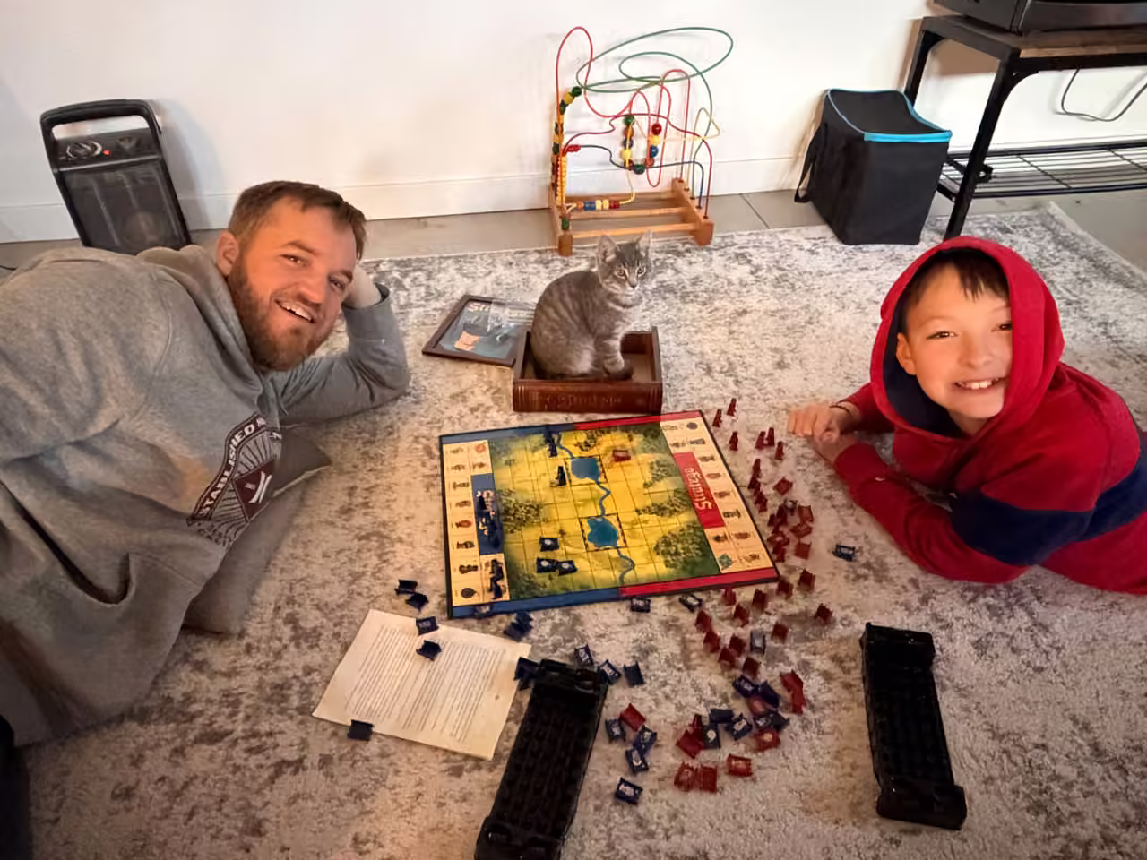 Board game night in the Starlit Ridge game room with the cat in the game box