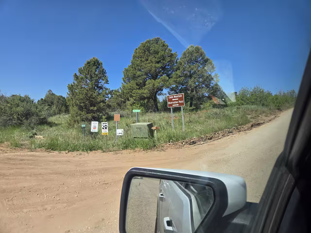 Cable Mountain and Observation Point directional sign at a road junction near the trailhead